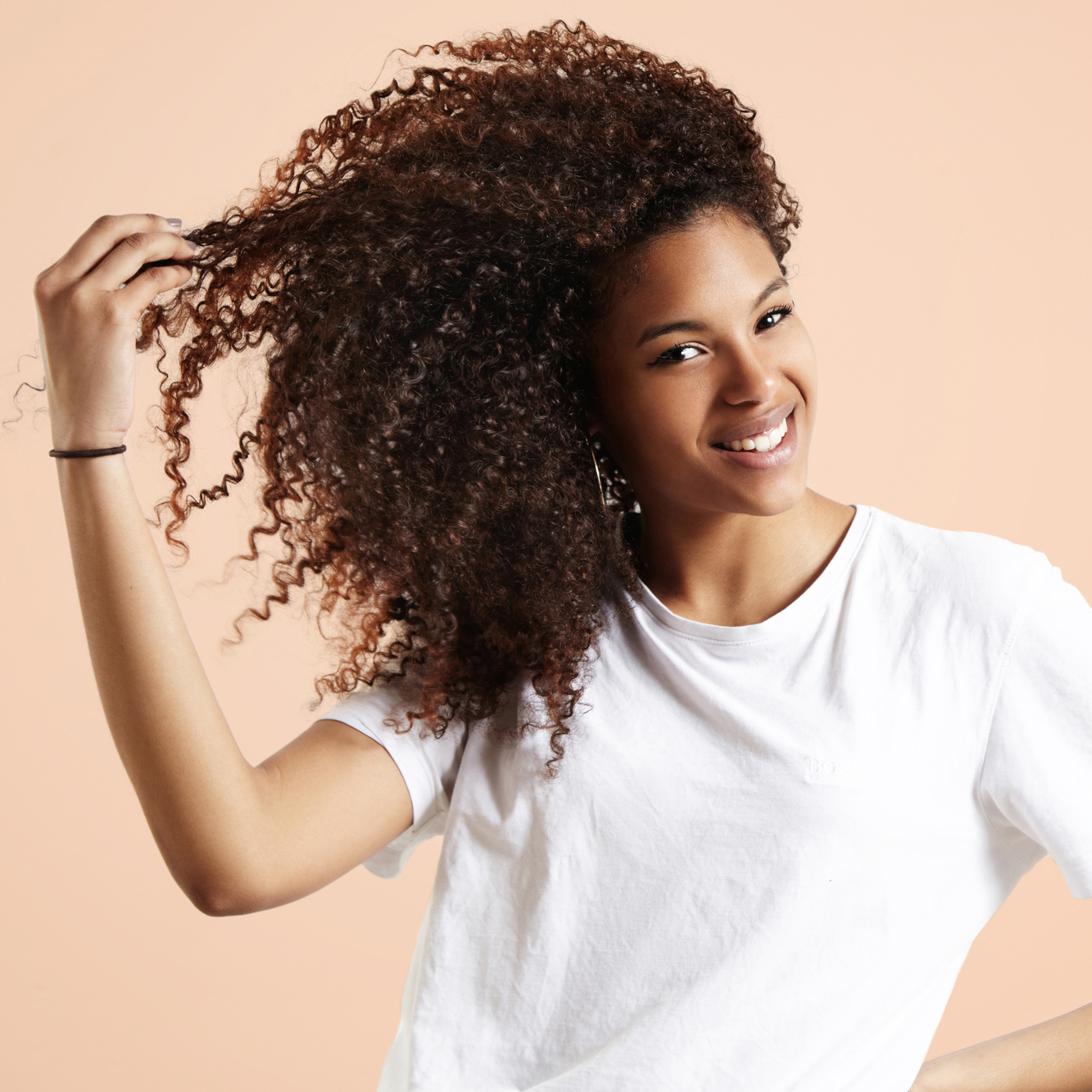 Smiling Woman Showing Curl Hairl
